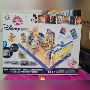 Disney Mini Brands Mini DisneyStore Edition Playset. 5 Mini Stores + 2 Suprises